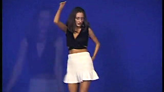 Brunette teen dancing and taking her clothes off