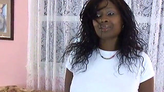 Hot black broad gets naked on couch