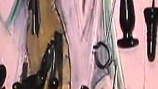 Dominatrix Trains Hooded Slave with Huge Dildo