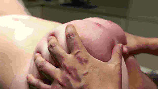 A Naked Woman with Huge Tits in a Massage Parlor Using Whipped Cream.
