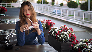 Magnetic Russian Beauty Playing with Cigarette Smoke