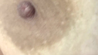 Mom plays with her big and delicious nipples