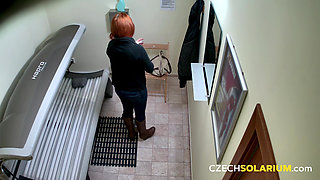 Czech Solarium 61: Busty Redhead Strips Down and Lets It All Hang Out