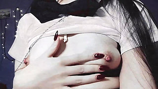 Gothic girl dressed as a Japanese schoolgirl with small tits and beautiful nipples