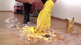 Brunette bitch trampling food and smoking a cigarette