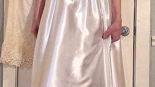 Trying on a liquid satin wedding dress.