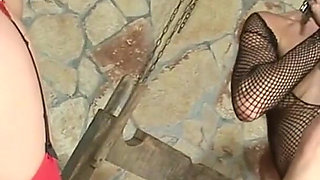 Two girls in latex outfits are fucked hard in the studio of torment