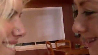 Two blonde babes play with each other