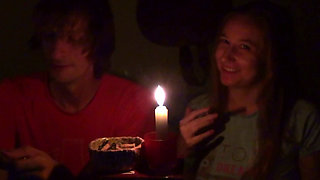 Couple Smoke Next to Candle