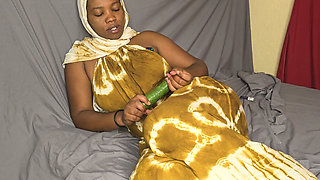 Hijab Fucking Herself Using Big Cucumber with Condom to Slide Into the Pussy
