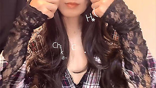 A video of a casual black-haired crossdresser quietly masturbating