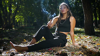 Seductive Russian Beauty Smoking Cigarette in Studio