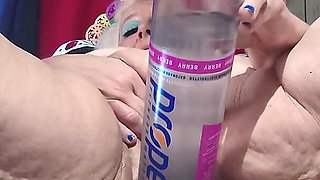 Big Bottle Plugged Clit Cunt