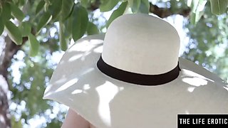 Cute girl in the hat rubbing her pussy out in the public place