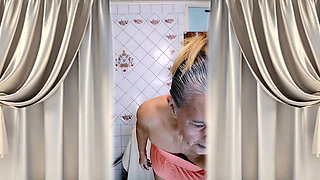 Elderly housewife Lukerya in the kitchen Cheerful flirting.