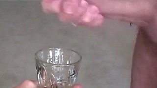 Blonde mature with big tits swallows hot cum from a glass