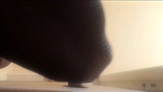 High-Heeled Milf Sucks and Fucks in a Catsuit at a Gloryhole