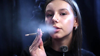 Young Girl Smoking Solo in a Calm Studio Session with Slow Exhales