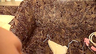 She is naked, blindfolded, and has her hands and feet tied, and is fingered deep in her throat.