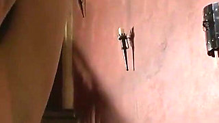 Chained Slaves Whipped in the Dungeon