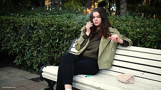 Young Brunette Is Taking an Unhurried Stroll with Allwhite 120mm Cigarette