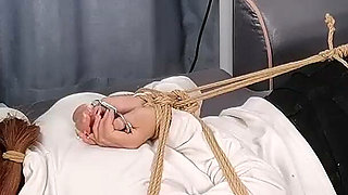 The Extreme Restraints of a Barefoot Girl, Playing with Her Bare Feet