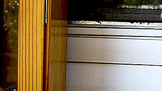 Shaved Head Goth Smokes Outside