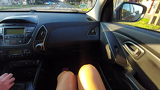 Elegant Mature Woman in a Short Skirt and High Heels in a Taxi in the Morning