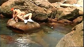 Dark-haired in Orange Cap Romped on Rocks by Congenital Pool