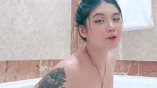 Busty babe playing with her big boobs