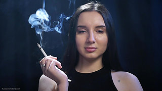 Elegant Brunette Smoking in Black Outfit