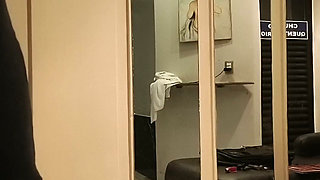 Woman in dress shoves dildo in her pussy