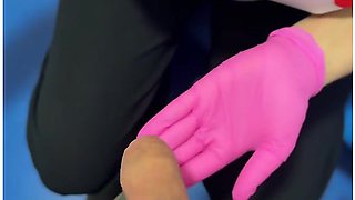 A Sperm Bank Nurse Milks Donated Sperm Into A Cup Wearing Pink Gloves