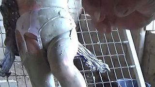 Tied to a Bed Frame Covered in Mud 00106